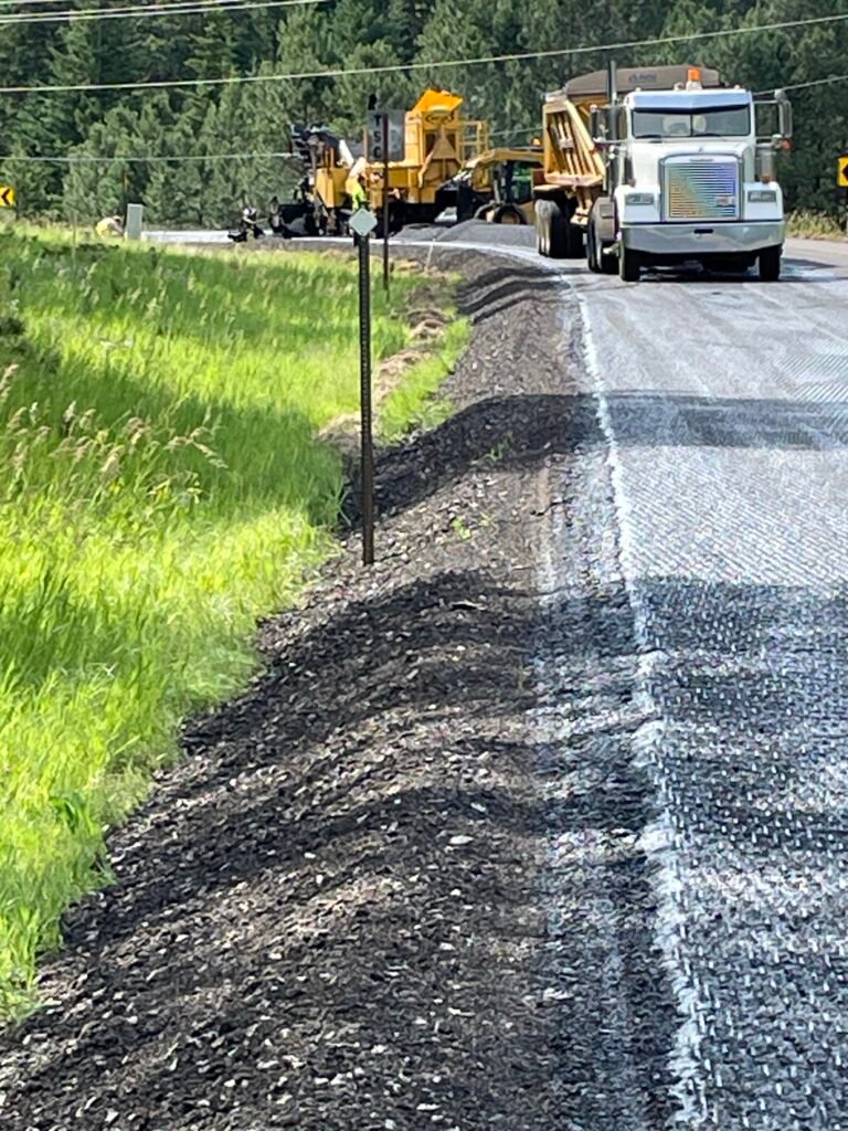 Belly Dump waiting on skid steer to dump